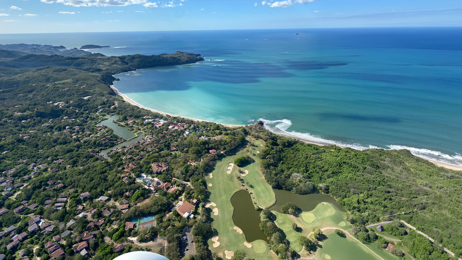 Aerial view of the Tamarindo coastline from a gyrocopter